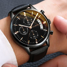 Men's leather watch with calendar feature in a chic style, suitable for sporty attire.