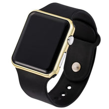 Close-up of black sport smartwatch with gold frame and black silicone strap isolated on white background.
