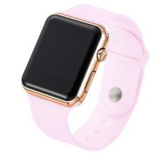 Smartwatch with a rose gold case and soft pink silicone band, angled view on a white background.